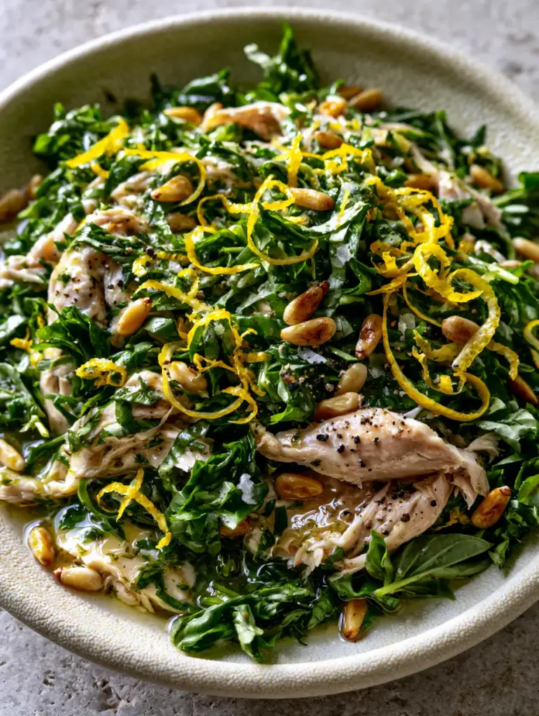 Lemon Basil Chicken Salad: A Vibrant No-Mayo Summer Favorite 1 Close-up of toasted golden pine nuts and hand-torn chicken in a Lemon Basil Chicken Salad.