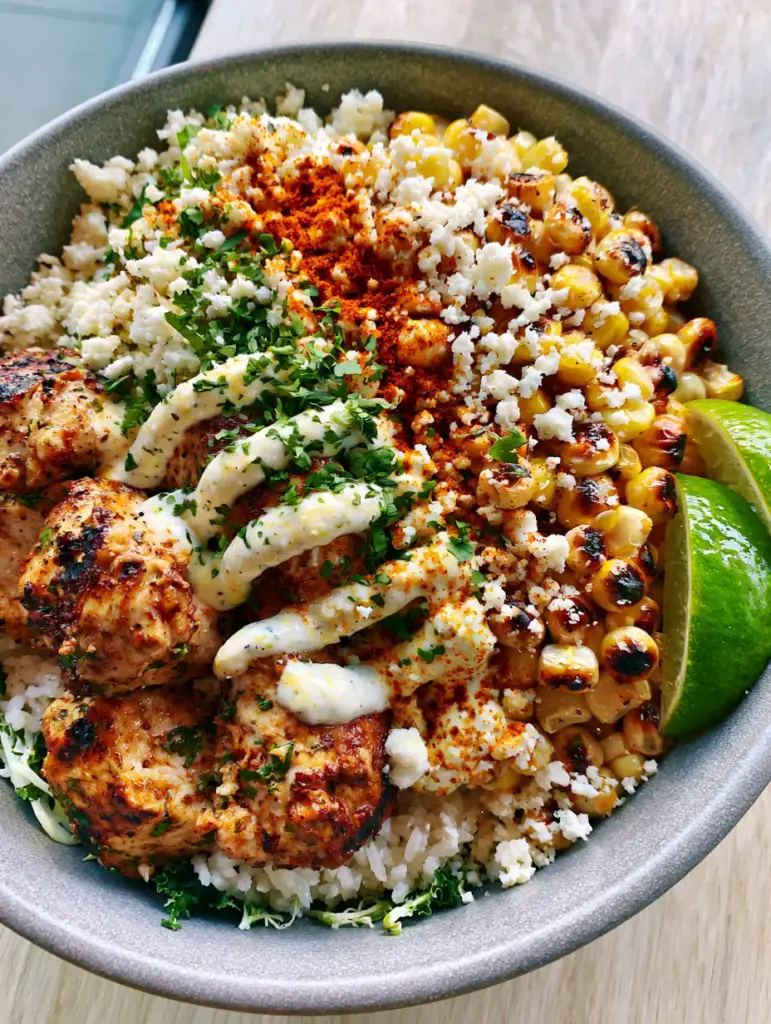 Street Corn Chicken Bowl with Charred Corn and Cilantro Lime Chicken 2 Macro shot of seared cilantro lime chicken and blistered corn in a Street Corn Chicken Bowl.