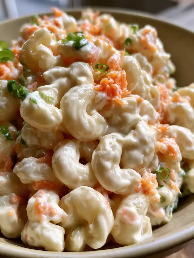 Hawaiian Macaroni Salad: The Authentic Creamy Plate Lunch Classic 2 Extreme macro close-up of Hawaiian macaroni salad showing plump noodles and glossy white dressing with green scallion flecks.