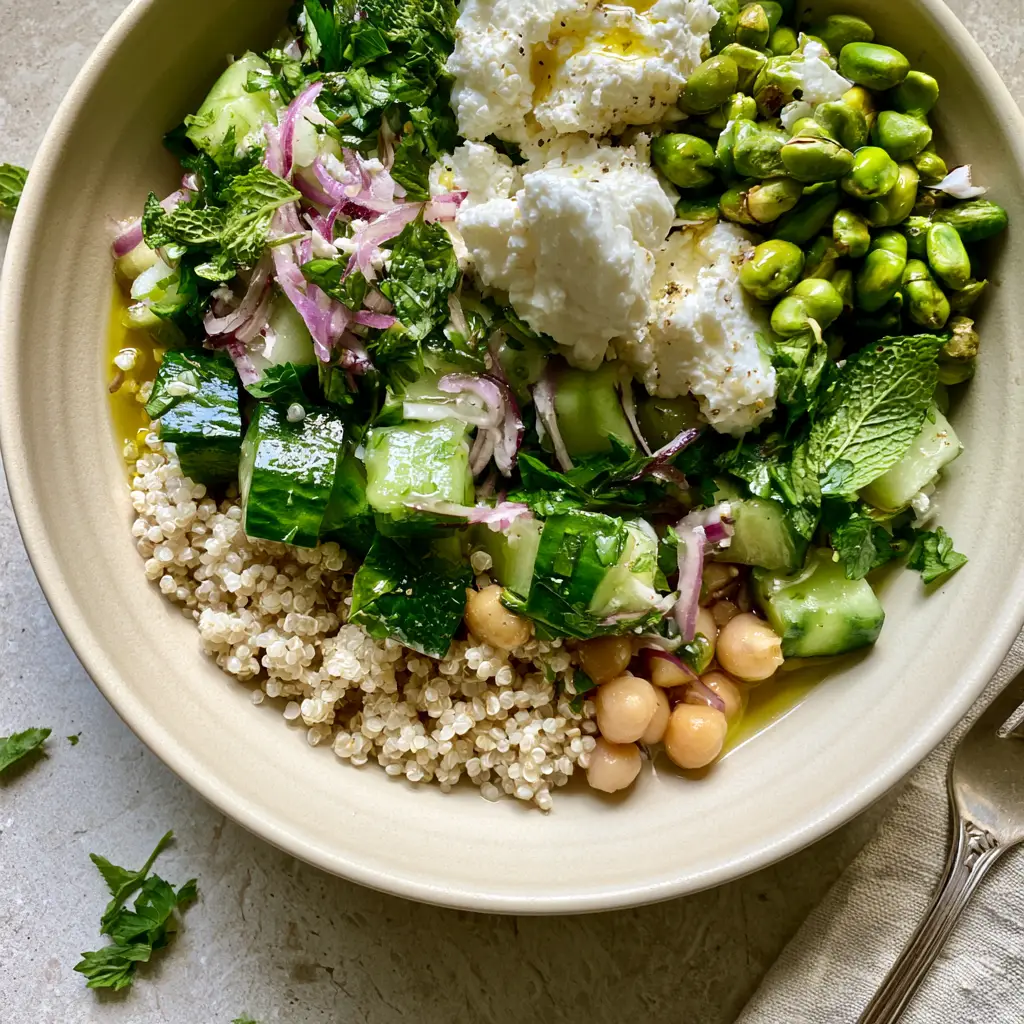 Jennifer Aniston Quinoa Salad: The Ultimate Viral Healthy Lunch 2 Freshly prepared Jennifer Aniston quinoa salad with glistening Persian cucumbers and creamy feta cheese.